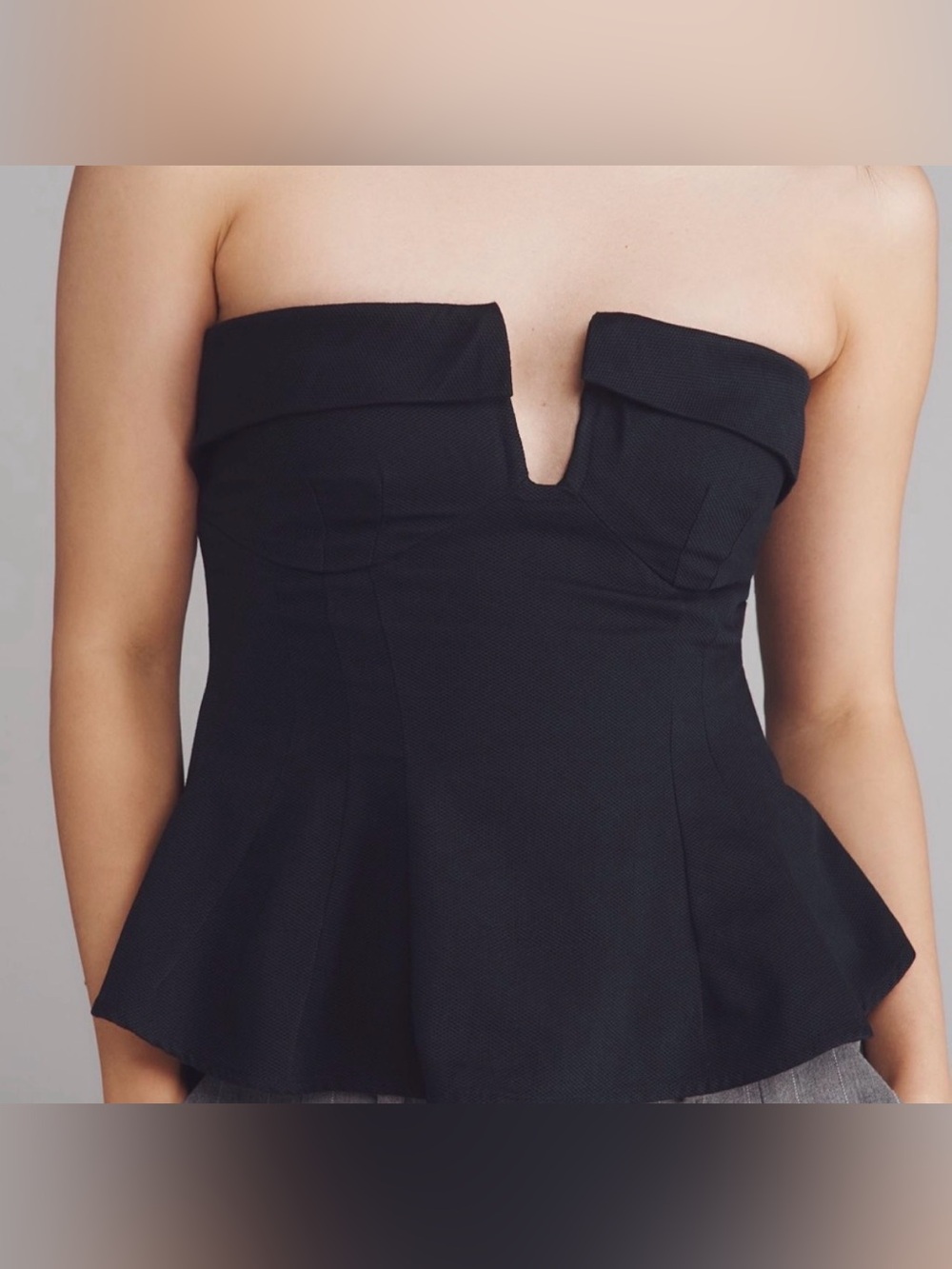 Maeve Strapless Black Peplum Top with Notch Detail